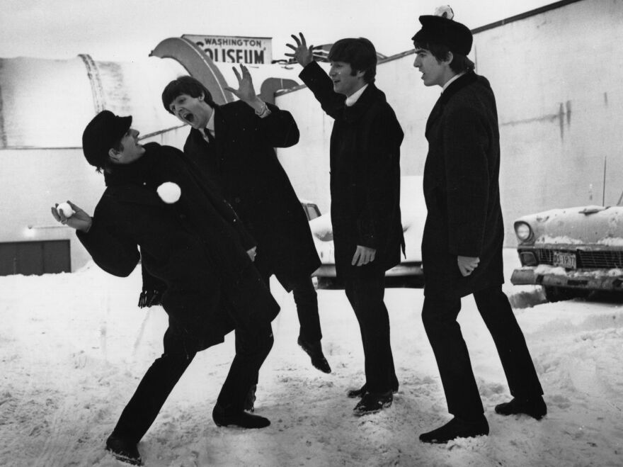 Members of The Beatles play in the snow outside Washington, D.C.'s Coliseum where they were scheduled to perform before a sell-out audience in 1964.