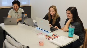 NAU students Aadarsha Bastola, Breelyn Cocke, and Haley Blakenship work on coding at the astroinformatics boot camp