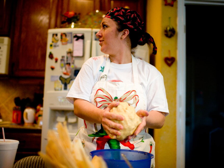 Gina Guereca remixes a bowl of <em>masa</em>, which she purchased from a <em>molina</em>, or mill.