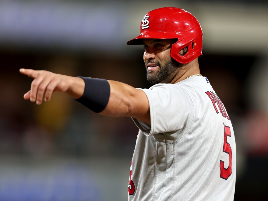 Albert Pujols of the St. Louis Cardinals points to the San Diego Padres dugout after hitting a single during the ninth inning of Monday night's game in San Diego. He ended the night with two singles, a walk and no home runs.