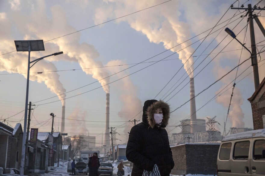 Heat-trapping emissions from burning fossil fuels, like these coal-fired power plants in Shanxi, China, have rebounded after dropping during the pandemic.