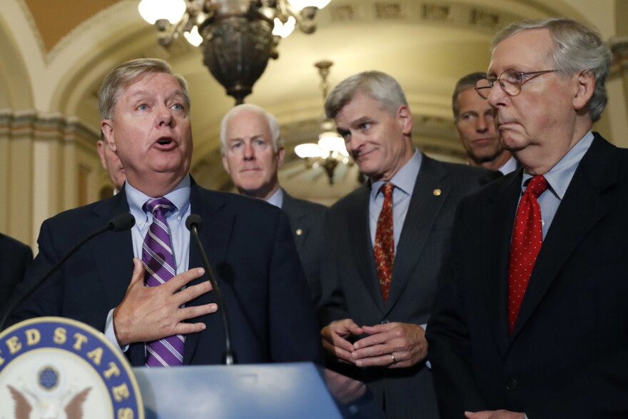 Sen. Lindsey Graham, R-S.C., speaks to the media, accompanied by Senate Majority Whip Sen. John Cornyn, R-Texas, Sen. Bill Cassidy, R-La., Sen. John Thune, R-S.D., and Senate Majority Leader Mitch McConnell of Ky. on Tuesday, Sept. 19 in Washington. (Alex Brandon/AP)