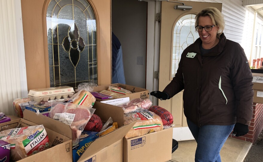 CHOP coordinator, Nicole Heyer checks the food boxes at the Pop Up Pantry in Sayre, Pa.