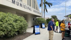People get free food from a Salvation Army truck outside a FEMA disaster recovery center in Sarasota, Florida