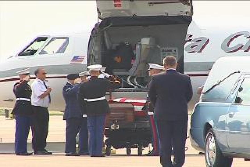 Lance Corporal Timothy G. Serwinowski's flagged draped casket was saluted