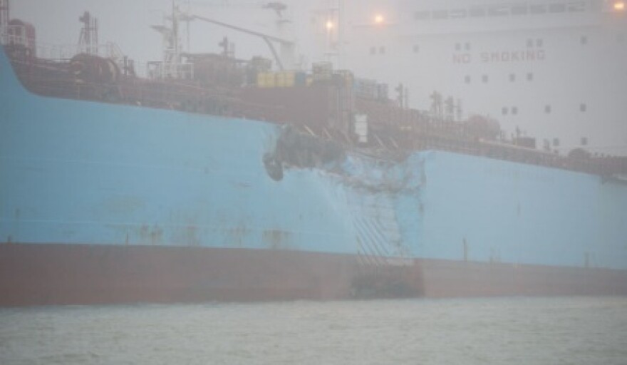 The chemical tanker Carla Maersk sits at anchor off Morgans Point, Texas, after Monday's collision in foggy weather. The Maersk was carrying about 216,000 barrels of the gas additive MTBE.