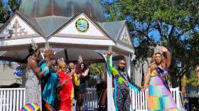 Mr. & Miss Ocala Pride wave to the crowd and pose for pictures. (Jack Lemnus/WUFT News)