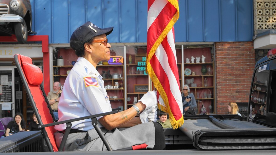 A woman holds an American flag