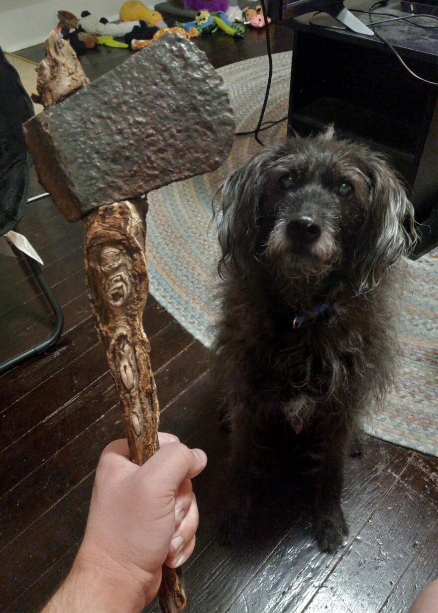 Matthew Decker shows off an ax he found in his front yard with a root handle.