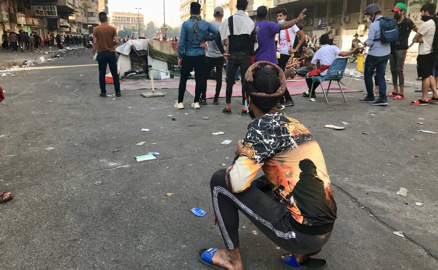 Protesters near Al Khalani Square in central Baghdad, moments before security forces opened fire to disperse the demonstrators.