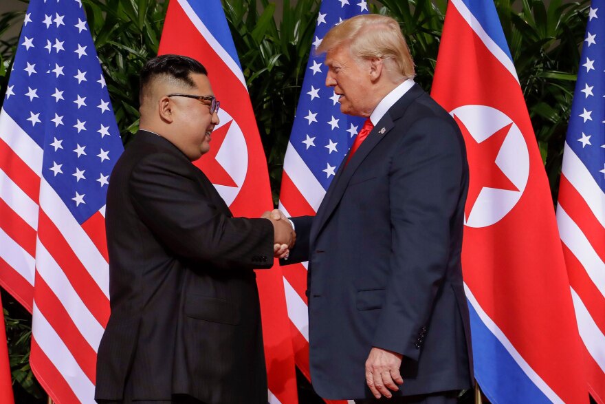 Mandatory Credit: Photo by Evan Vucci/AP/Shutterstock (9710094b) Donald Trump, Kim Jong Un. U.S. President Donald Trump shakes hands with North Korea leader Kim Jong Un at the Capella resort on Sentosa Island in Singapore Trump Kim Summit, Singapore, Singapore - 12 Jun 2018