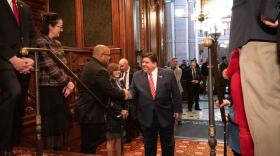 Gov. Pritzker enters the Illinois House chamber in February to deliver his budget address