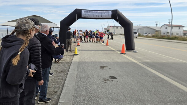 Spectators watch before the start of the Cape Blossom marathon on August 29.