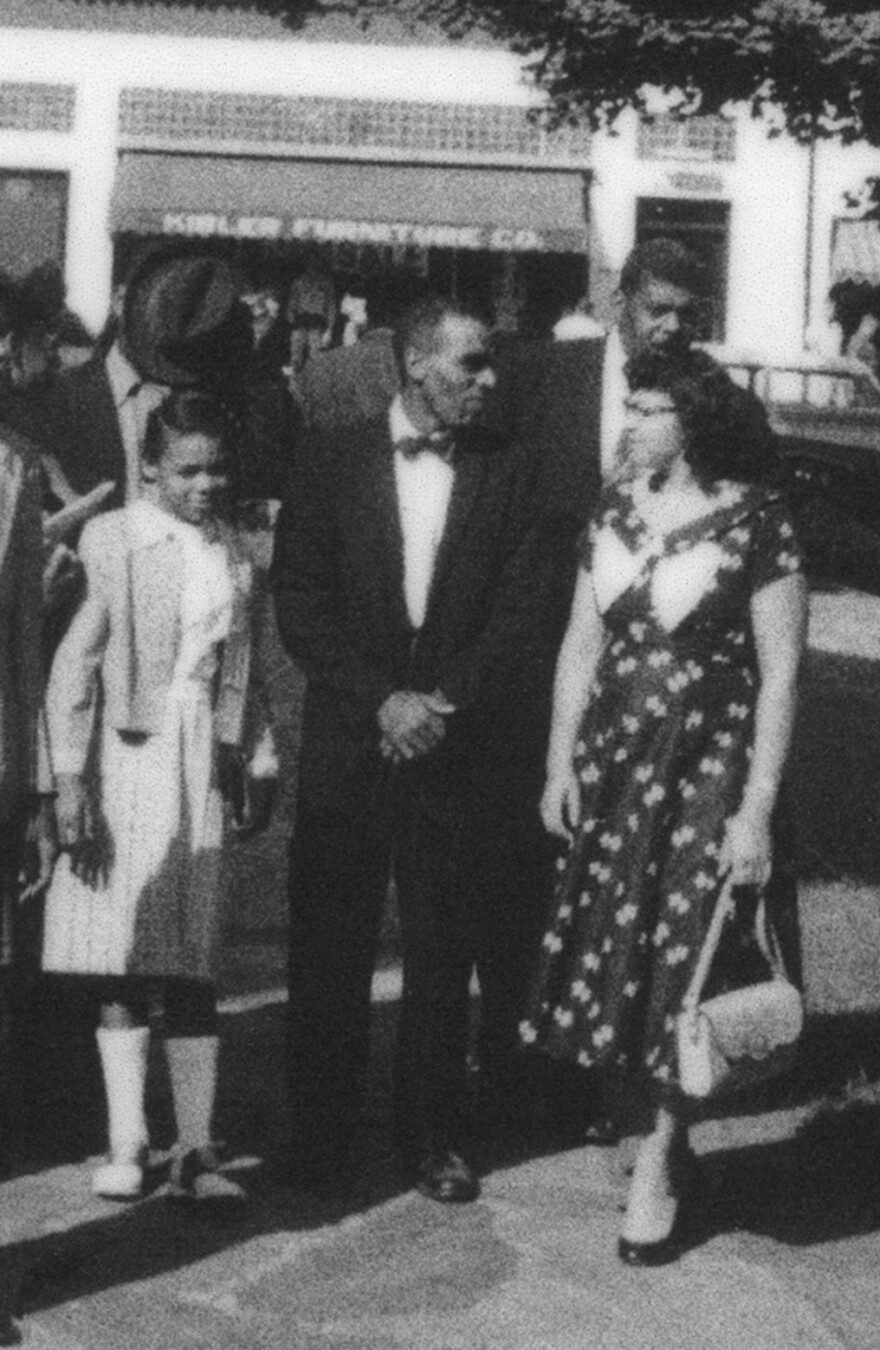 Betty (on the left) with her parents.