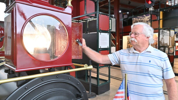 Dan Hryhorcoff closes the lantern of the train, which he made of fiberglass.