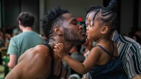 Terrance Reed kisses his daughter.