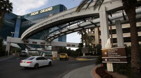 Cars drive into the MGM Grand hotel and casino in Las Vegas in January 2016. MGM International began charging for parking at its resorts in the city in June. (John Locher/AP)