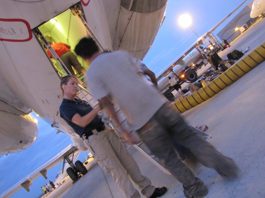 An ICE deportation flight to Guatemala City prepares to take off from Mesa, Ariz.