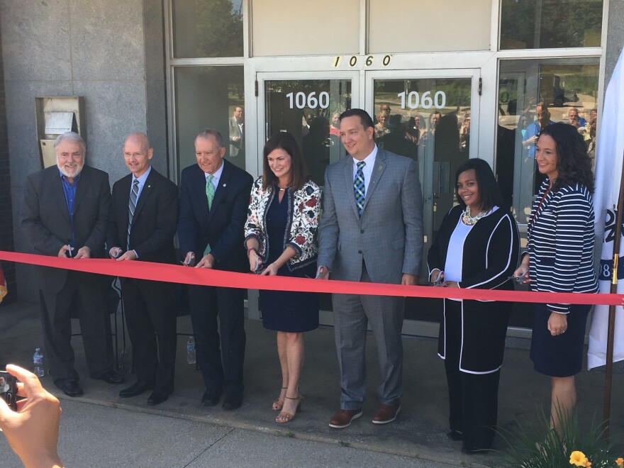 City officials and members of the United Way of Summity County cut the ribbon on the nation's 20th Financial Empowerment Center.