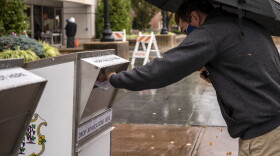 Cody Richter 21, drops off his ballot for his first presidential election at the West Hartford Town Hall ballotbox on October 28, 2020 in West Hartford, Connecticut.