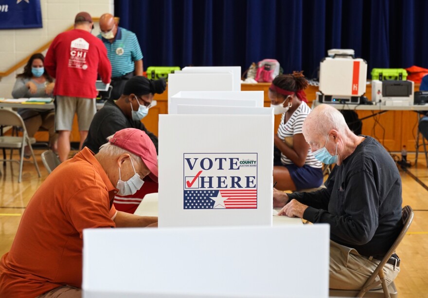 Voters fill out their ballots for Missouri’s primary election at Old Bonhomme Elementary School in Olivette on Tuesday morning.