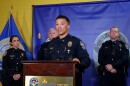 LMPD Assistant Chief Paul Humphrey, center, speaking at Monday's press conference announcing the release of body camera footage.