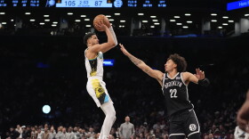 Indiana Pacers' Tyrese Haliburton, left, shoots over Brooklyn Nets' Jalen Wilson (22) during the second half of an NBA basketball game, Monday, Jan. 6, 2025, in New York. (AP Photo/Frank Franklin II)