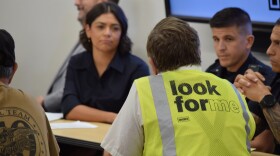 Resident speaks with police officers and city councilor Johana Bencomo