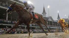 Mike Smith rides Justify to victory during the 144th running of the Kentucky Derby horse race at Churchill Downs Saturday, May 5, 2018, in Louisville, Ky.