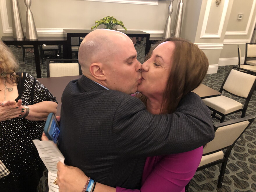 Lori Alhadeff kisses her husband, Ilan, after learning she won a seat on the Broward County school board.