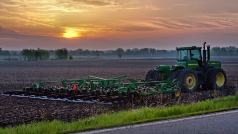 farm tractor at sunset