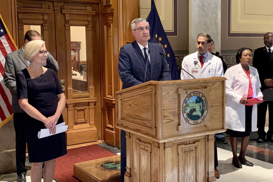 Gov. Eric Holcomb announces a Marion County woman is Indiana's first COVID-19 death.