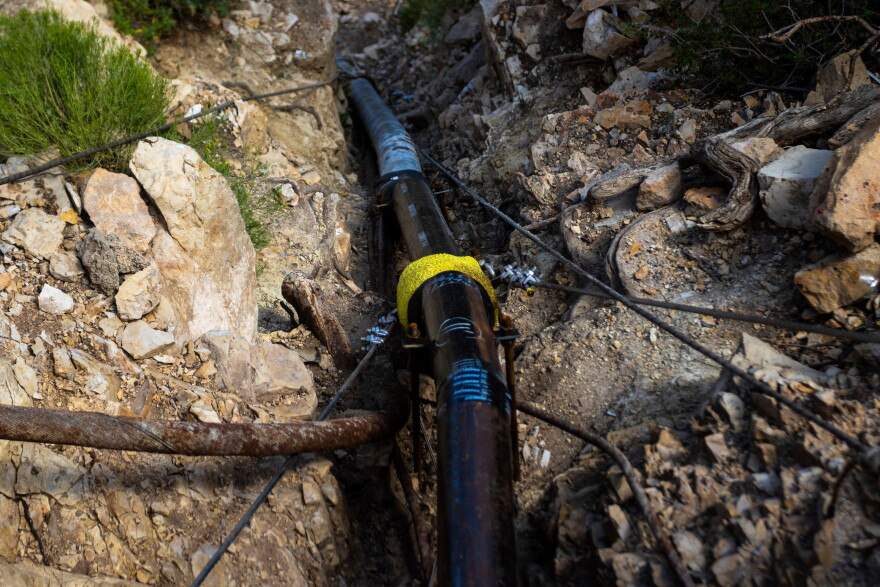 FILE - A section of pipeline that brings water to the South Rim of Grand Canyon National Park is seen below Bright Angel Lodge in Arizona, Aug. 30, 2024.