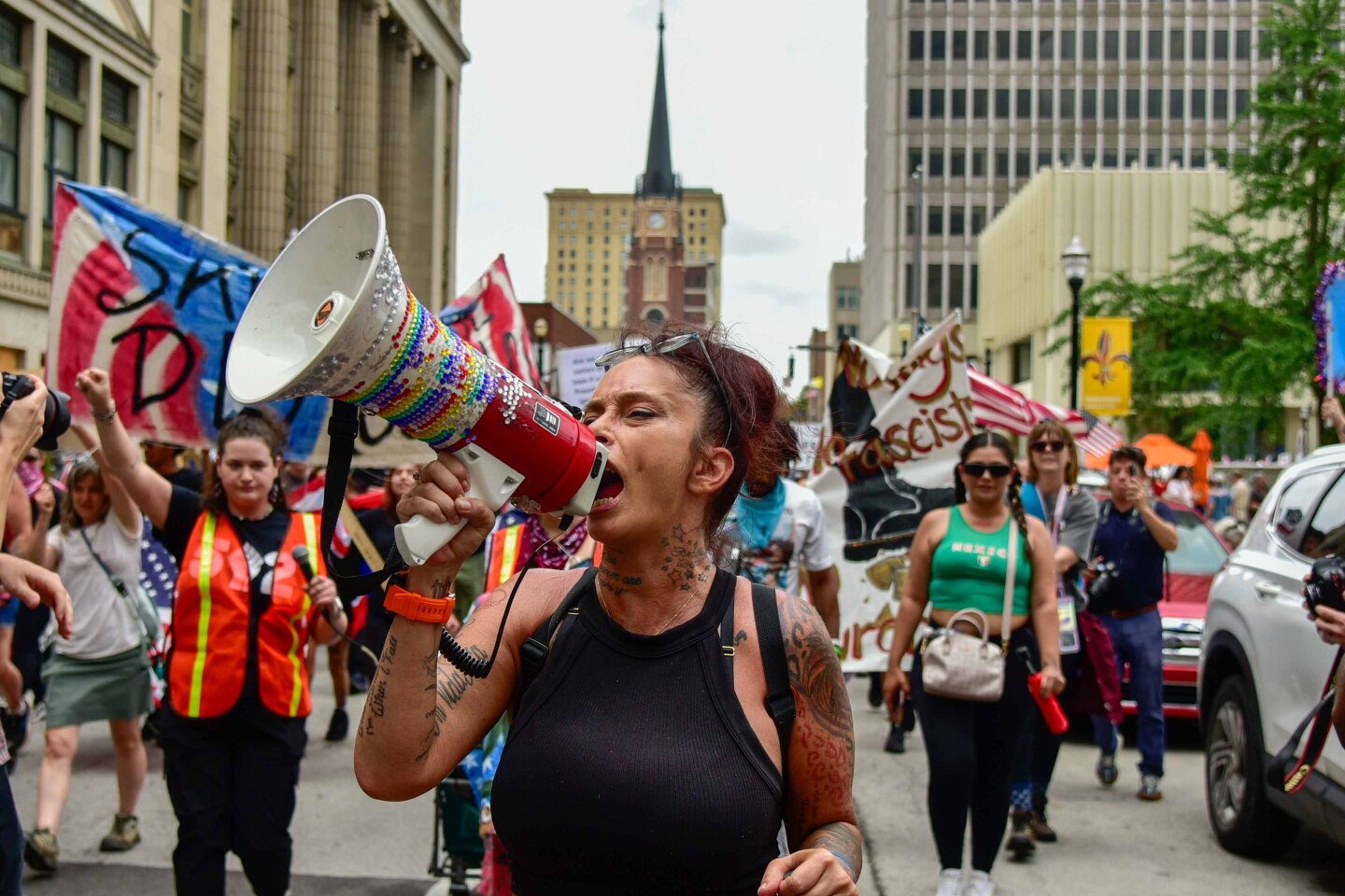 Summer Dickerson leads "No Kings" protestors in a march down 5th Street in downtown Louisville.