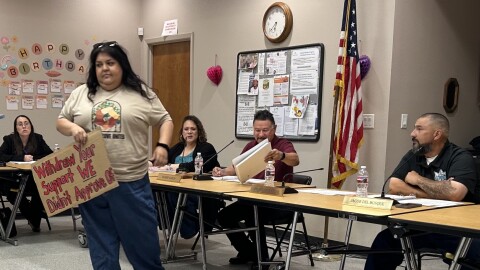 Estela Juarez presents a petition to the Orange Cove City Council during an April 22 meeting signed by 652 residents objecting to the city’s participation in a hydrogen blending project planned by the Southern California Gas Co.