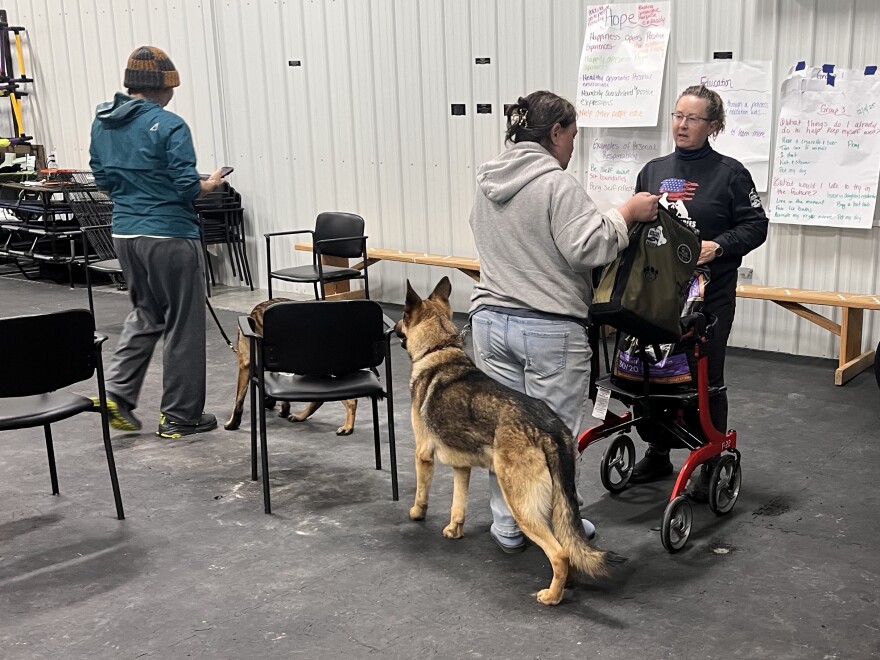 Dog Tag Buddies Executive Director DeeDe Baker (far right) with a veteran