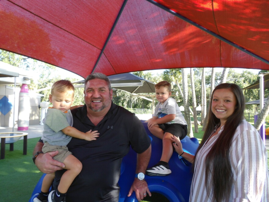 Savannah Vaughan poses for a photo with her father, Robert Strohschein, and her two sons, Donovan and Owen Vaughan, at Children First in Sarasota on Sept. 9, 2026.