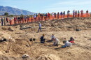 Pima County Historic Preservation Officer Ian Milliken speaks to a crowd at the Sunset Road archaeological site during a public viewing event in 2016.