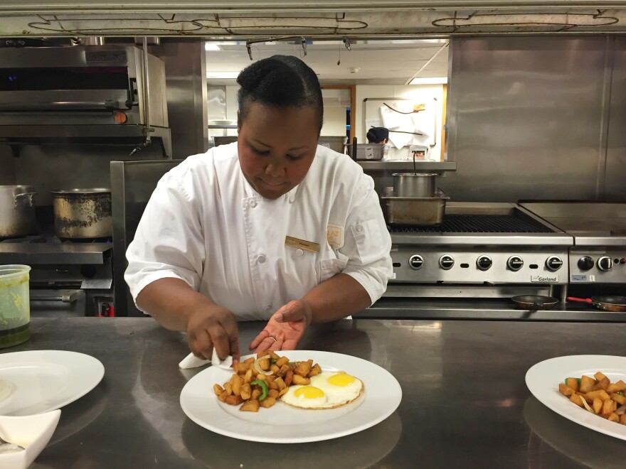 Florance Eloi preps a dish at Hilton's Conrad Miami. Eloi received 10 weeks' paid leave when she had her baby. The Labor Department says only 13 percent of workers in the private sector — and even fewer among hourly workers — have paid parental leave.