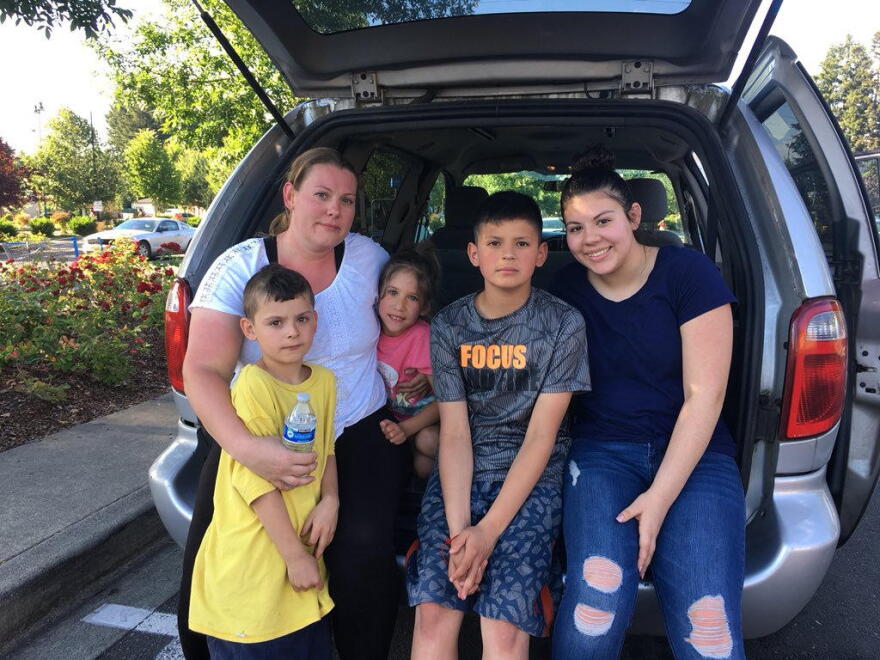 Megan Chadwick of Eugene, Oregon, with her children outside the Walmart store in Tumwater.