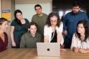 Nev Jones (center) presents information on a laptop to members of her research team at the University of Pittsburgh Path Lab in an undated photo.