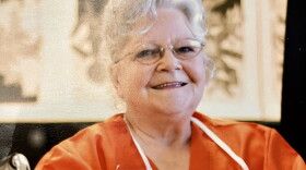 Cathy Lamb smiles at an art show for incarcerated women.