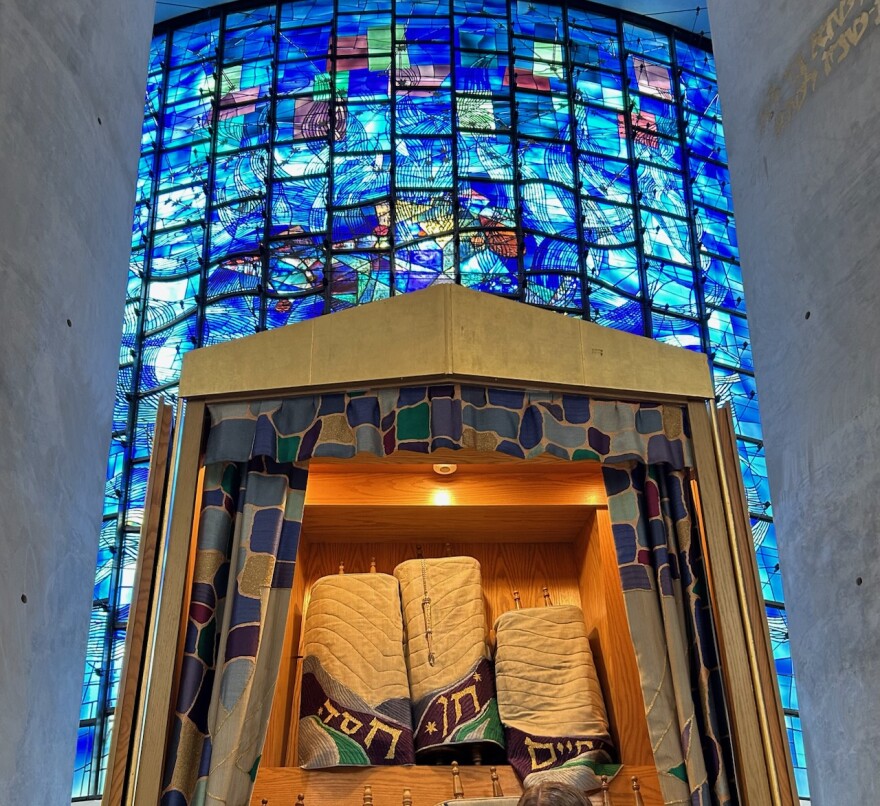 Image of the inside of Temple Beth Zion in Buffalo, including its large stained-glass window.