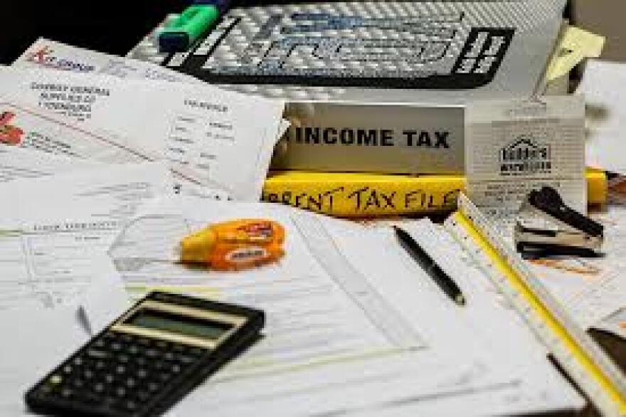 Income Tax and Tax Files On Desk