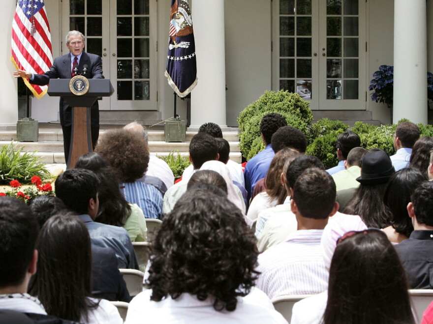 Former President George W. Bush speaks to student from the Youth Exchange and Study program at the White House in 2005. The program began in 2004 and ended for Afghan students this year after half of those enrolled fled to Canada.
