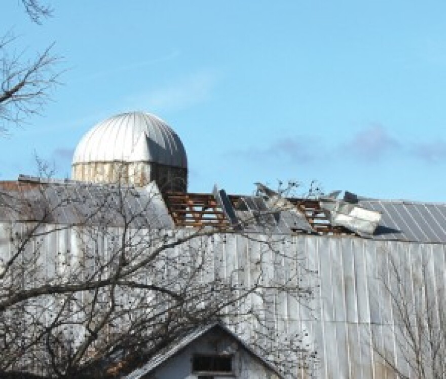 A roof on Murray Paris Road was damaged Sunday night by high winds during a severe thunderstorm. Debris from the roof were blown across the property, into trees and across the road onto another field.