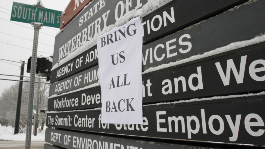 A sign is posted at the entrance to the state office complex on in Waterbury, Vt., About 1,500 people who worked in the complex were relocated due to damage caused by Tropical Storm Irene. 