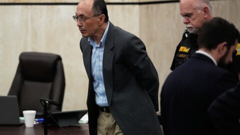 Chikei Rick Chow, left, accused in the 2023 fatal shooting of a Black 14-year-old, is escorted in the courtroom during his murder trial, Friday, May 29, 2026, in Columbia, S.C. (AP Photo/Erik Verduzco)