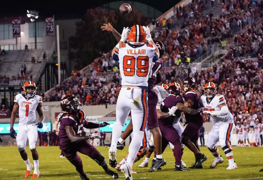 Dan Villari (89, white) catching a pass