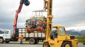 About 80 retired nets have been baled up and are on their way to a recycling program halfway around the world. (Photo by Berett Wilber/KUCB)